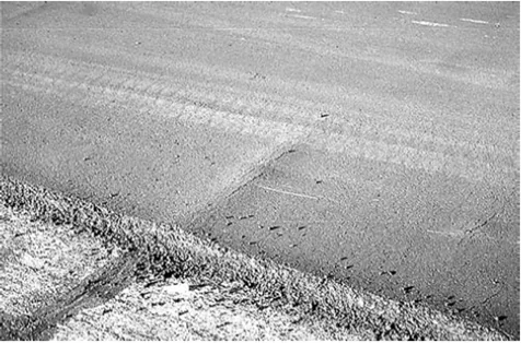 Figure 59. Bump Caused by Excessive Use of Crack Sealant