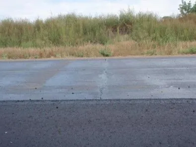 Figure 64. Non-Uniform Application of Tack Coat