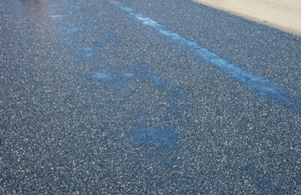 Figure 172. Fat Spot Caused by Localized Excess Asphalt