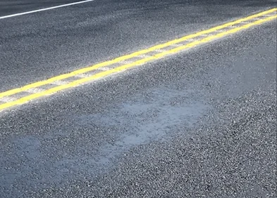 Figure 173. Fat Spot Caused by Fuel Oil Spill Prior to Overlay Construction